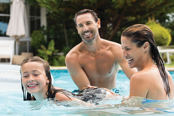 Family is playing in the pool - New Home Community - New Construction Homes For Sale in Parrish, FL